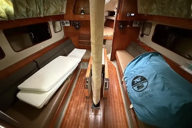 Slide: The Image of Interior of 1981 C&C Landfall 38 sailboat with wooden flooring and seating. - 16