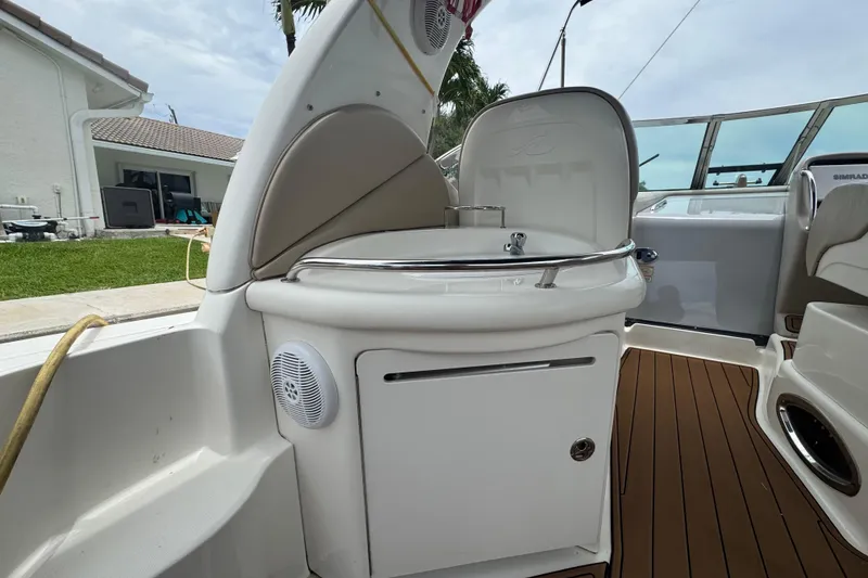 Slide: The Image of 2004 Sea Ray 340 Sundancer boat interior with sink and seating area. - 17