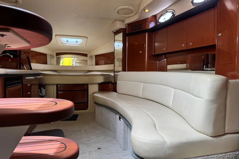 Slide: The Image of Luxurious interior of a 2004 Sea Ray 340 Sundancer yacht with elegant seating and wood finishes. - 22