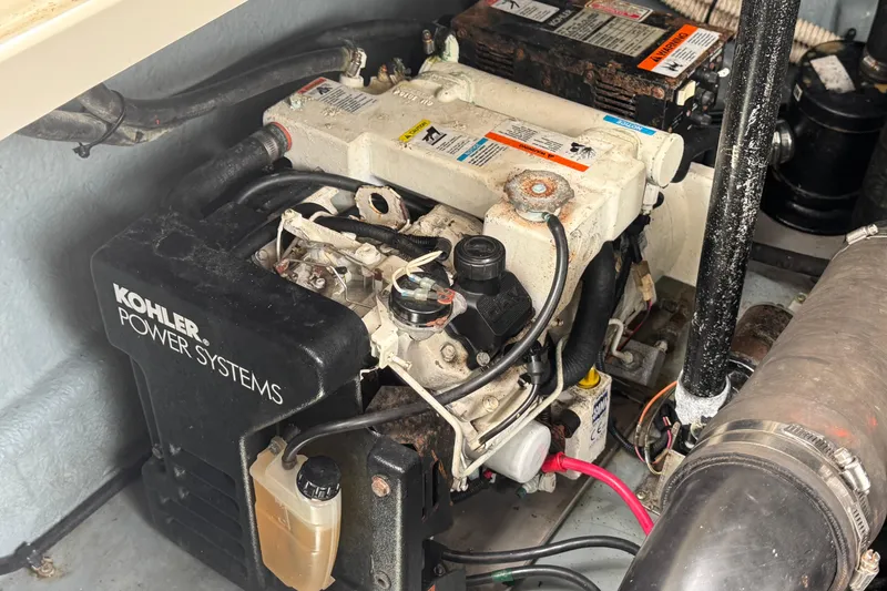 Slide: The Image of Engine compartment of a 2004 Sea Ray 340 Sundancer with Kohler power system. - 35