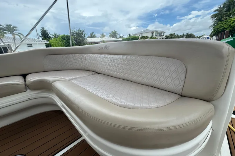 Slide: The Image of Luxurious seating on a 2004 Sea Ray 340 Sundancer boat, featuring elegant upholstery. - 14