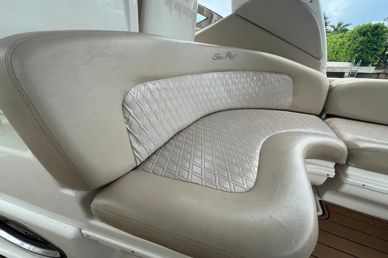 Slide: The Image of Luxurious seating on a 2004 Sea Ray 340 Sundancer boat with elegant diamond-pattern upholstery. - 16