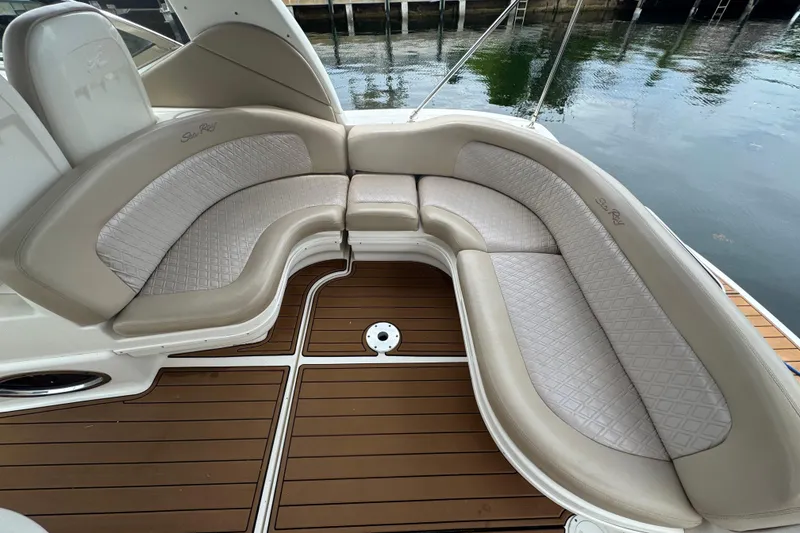 Slide: The Image of Luxurious seating on a 2004 Sea Ray 340 Sundancer boat with elegant upholstery. - 13