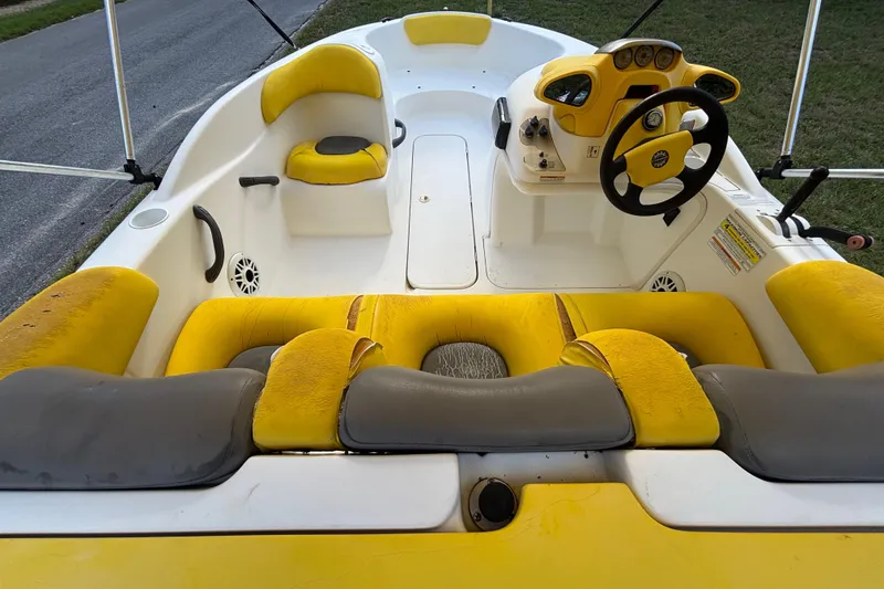 Slide: The Image of 2004 Sea-Doo Sportster LE DI boat interior with yellow and gray seating. - 13