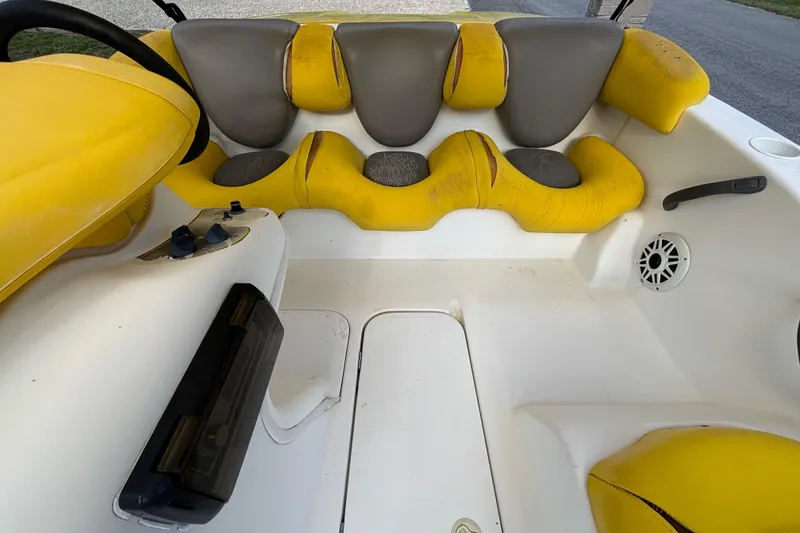 Slide: The Image of 2004 Sea-Doo Sportster LE DI boat interior with yellow and gray seating. - 29