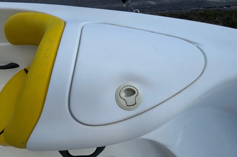 Slide: The Image of 2004 Sea-Doo Sportster LE DI boat interior with yellow seating and storage compartment. - 22