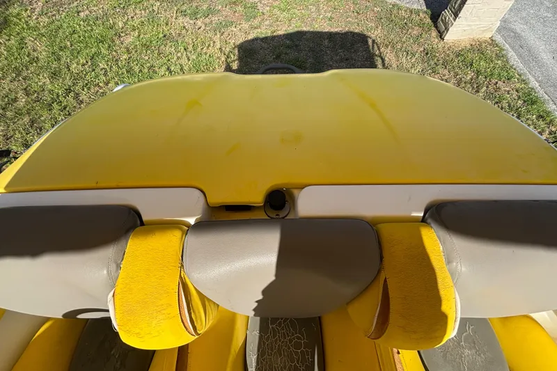 Slide: The Image of Yellow 2004 Sea-Doo Sportster LE DI boat interior with gray seats, viewed from above. - 31