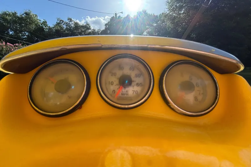 Slide: The Image of Dashboard of a 2004 Sea-Doo Sportster LE DI with gauges under sunlight. - 17