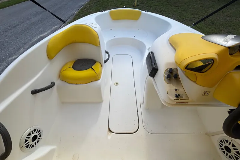 Slide: The Image of 2004 Sea-Doo Sportster LE DI boat interior with yellow seating and control panel. - 20