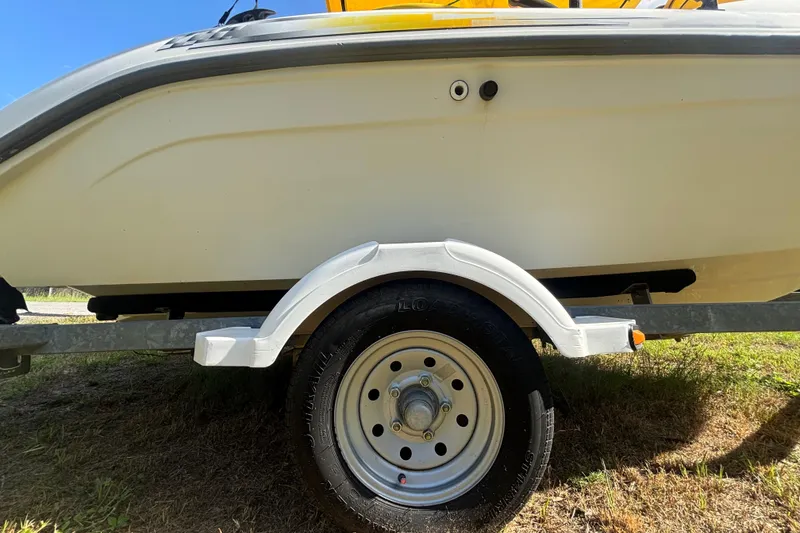 Slide: The Image of 2004 Sea-Doo Sportster LE DI boat on trailer, side view with wheel detail. - 37
