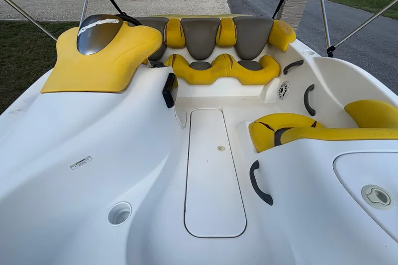 Slide: The Image of 2004 Sea-Doo Sportster LE DI boat interior with yellow and gray seating. - 24