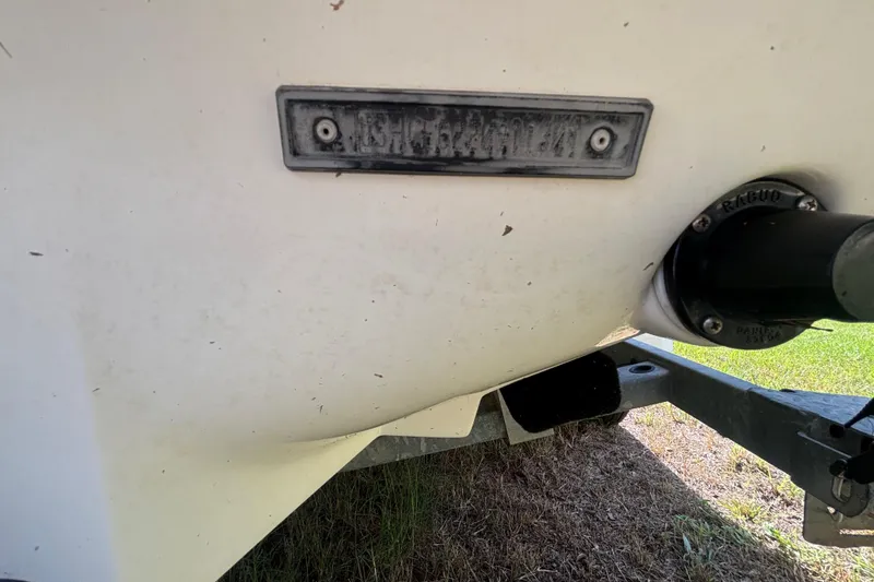 Slide: The Image of 2004 Sea-Doo Sportster LE DI boat hull with identification plate and trailer attachment. - 41