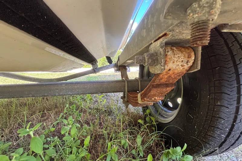 Slide: The Image of Rusty trailer suspension under a 2004 Sea-Doo Sportster LE DI boat. - 38