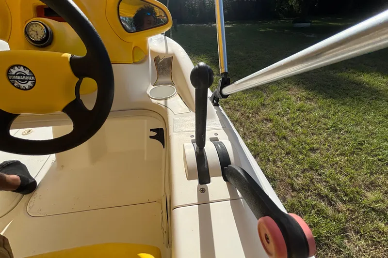 Slide: The Image of 2004 Sea-Doo Sportster LE DI boat interior with steering wheel and throttle controls. - 19