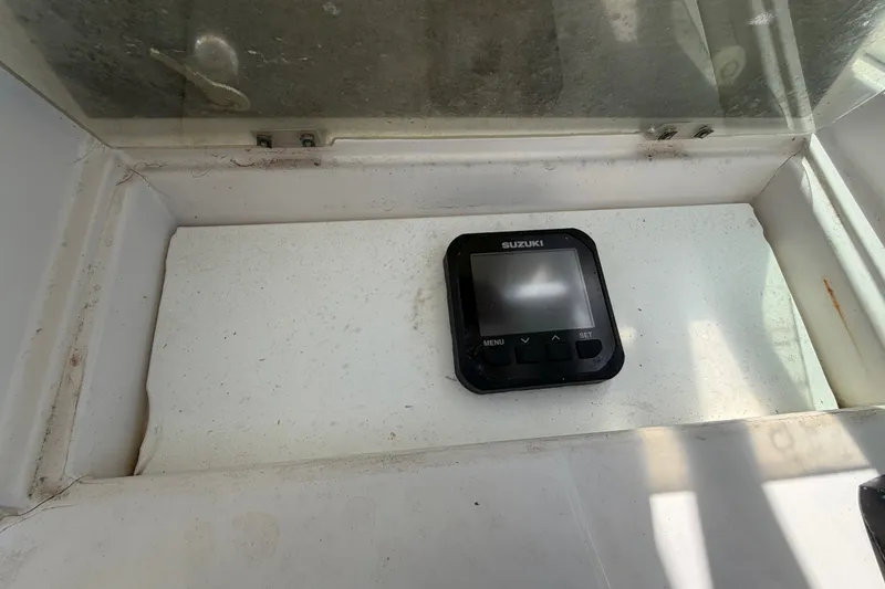 Slide: The Image of Suzuki display on 1986 Grady-White Seafarer 226 boat dashboard. - 13