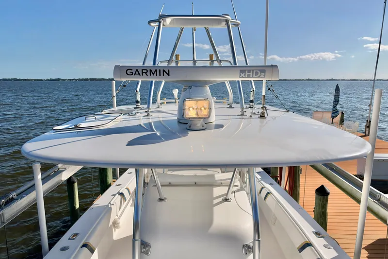 Slide: The Image of 2004 Venture 34 Cuddy boat with Garmin xHD2 radar on calm water. - 48