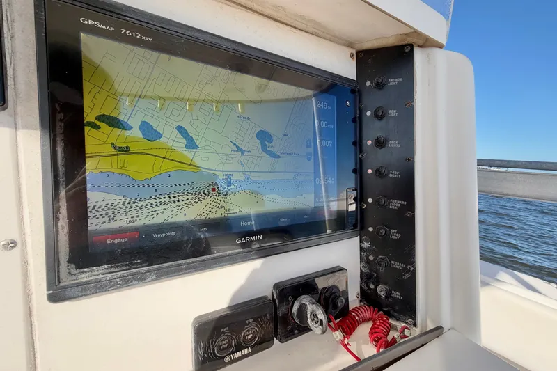 Slide: The Image of Garmin GPS display on 2004 Venture 34 Cuddy boat, showing navigation map and control panel. - 22