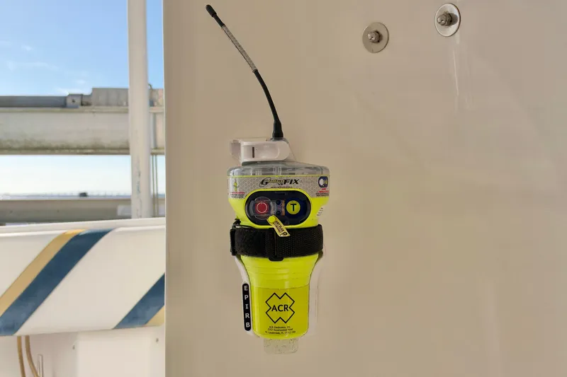 Slide: The Image of Emergency beacon mounted on a 2004 Venture 34 Cuddy boat. - 43