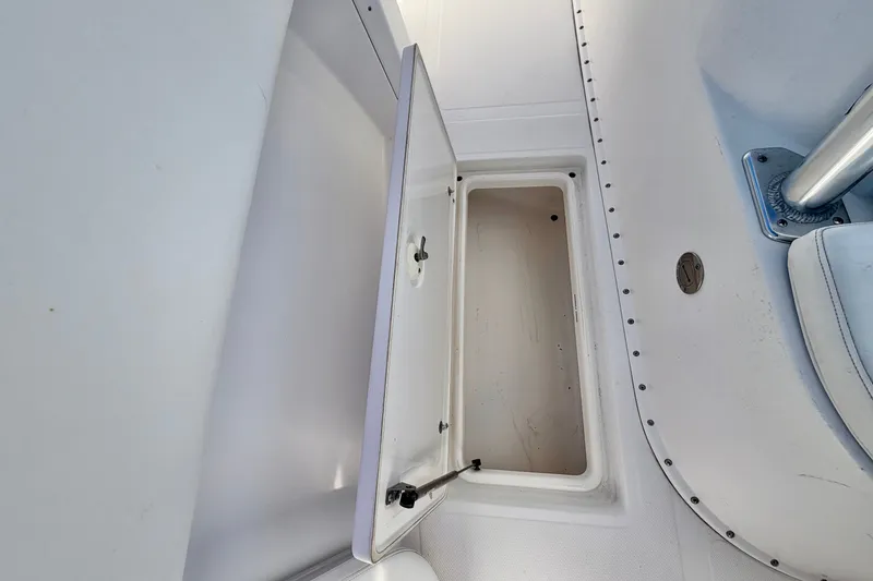 Slide: The Image of Open storage compartment on 2004 Venture 34 Cuddy boat deck. - 59