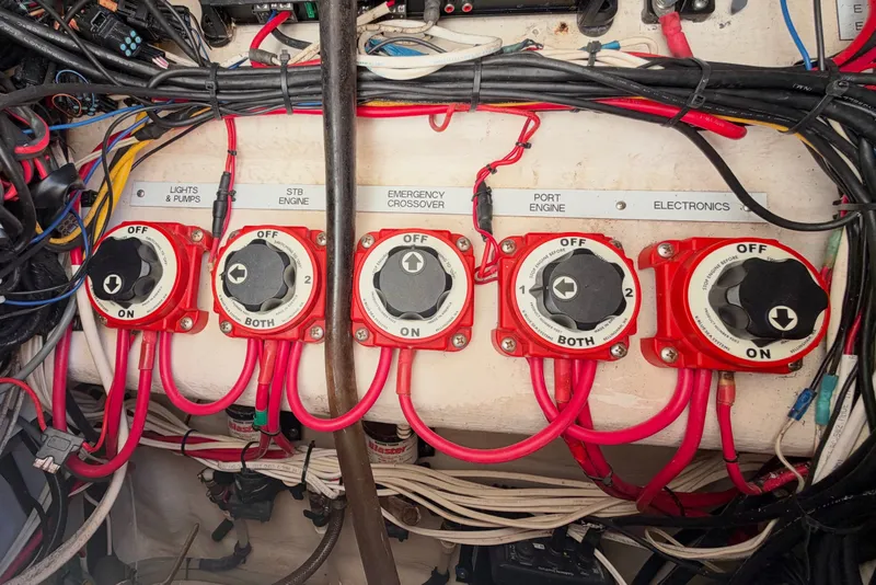 Slide: The Image of Electrical panel with switches and wiring on a 2004 Venture 34 Cuddy boat. - 42