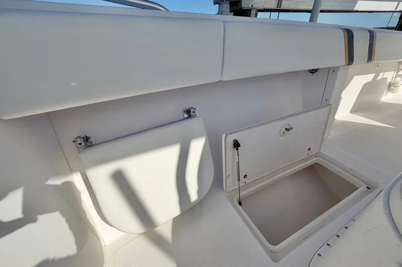 Slide: The Image of 2004 Venture 34 Cuddy boat storage compartments, open and ready for use. - 58