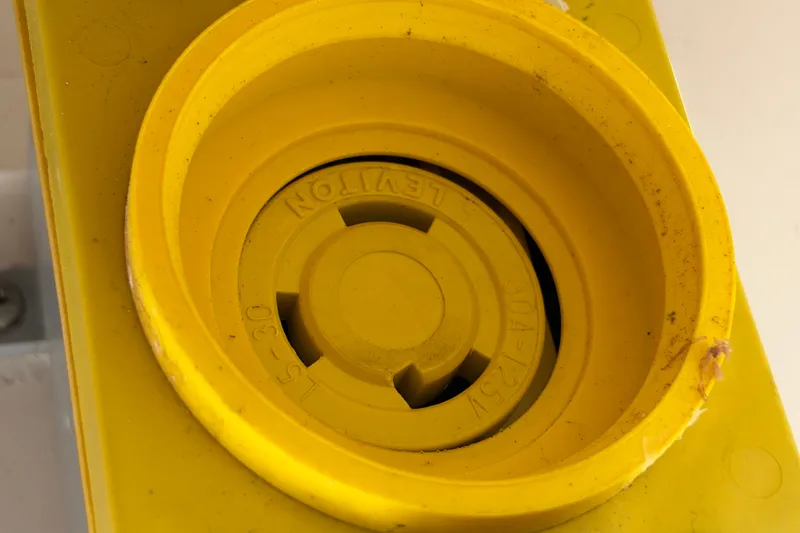 Slide: The Image of Yellow electrical outlet on a 2004 Venture 34 Cuddy boat. - 99