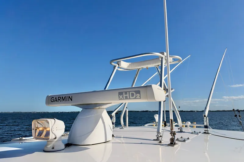 Slide: The Image of 2004 Venture 34 Cuddy boat with Garmin xHD2 radar on open water. - 50
