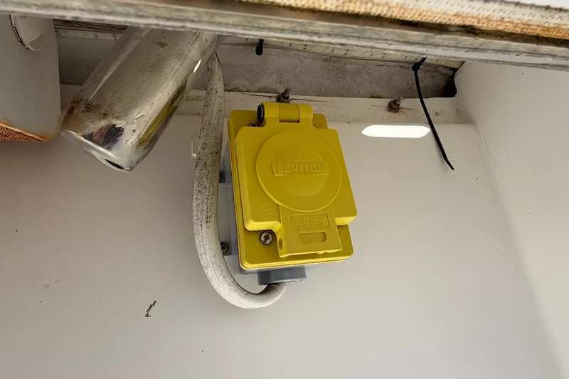 Slide: The Image of Yellow Leviton electrical outlet on 2004 Venture 34 Cuddy boat. - 100