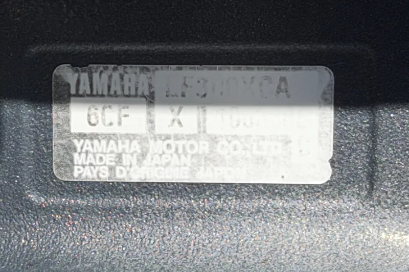 Slide: The Image of Label on Yamaha motor, showing model details and manufacturing origin. - 89
