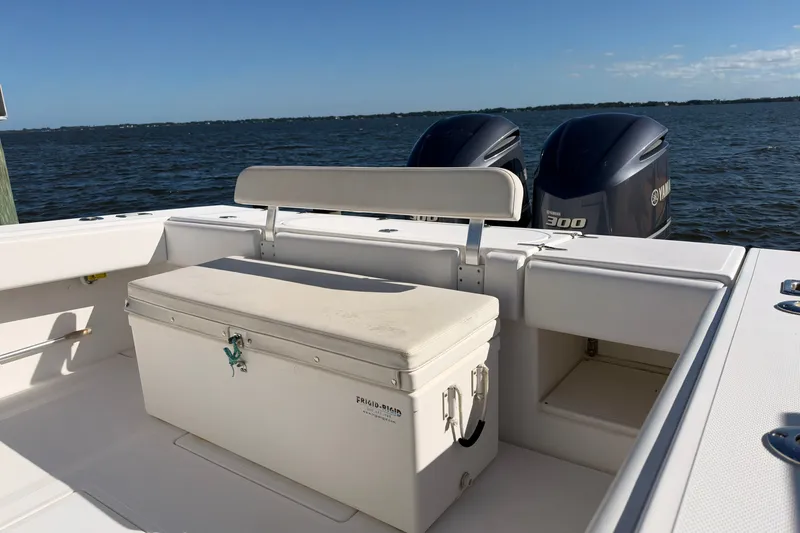 Slide: The Image of 2004 Venture 34 Cuddy boat with dual Yamaha 300 engines on a sunny day. - 65
