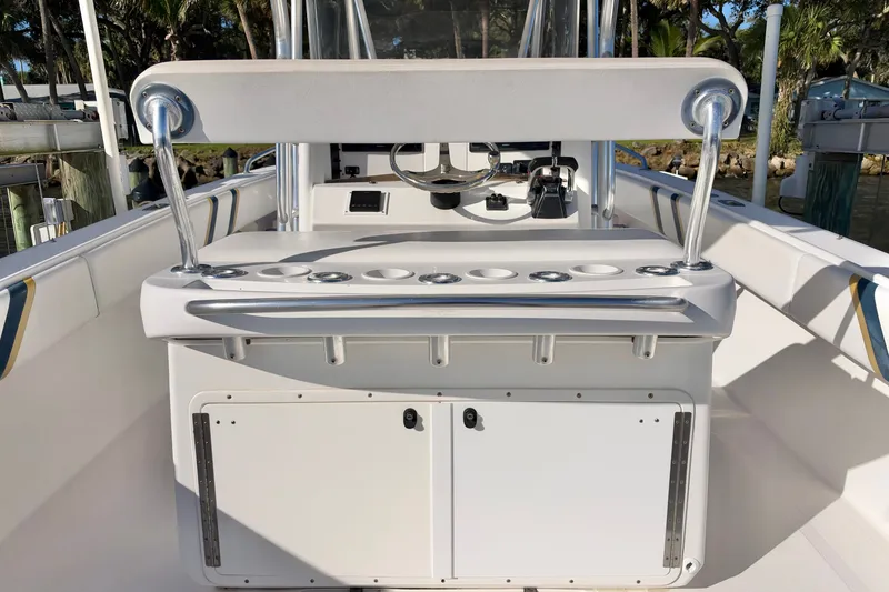 Slide: The Image of 2004 Venture 34 Cuddy boat interior with helm station and seating. - 17