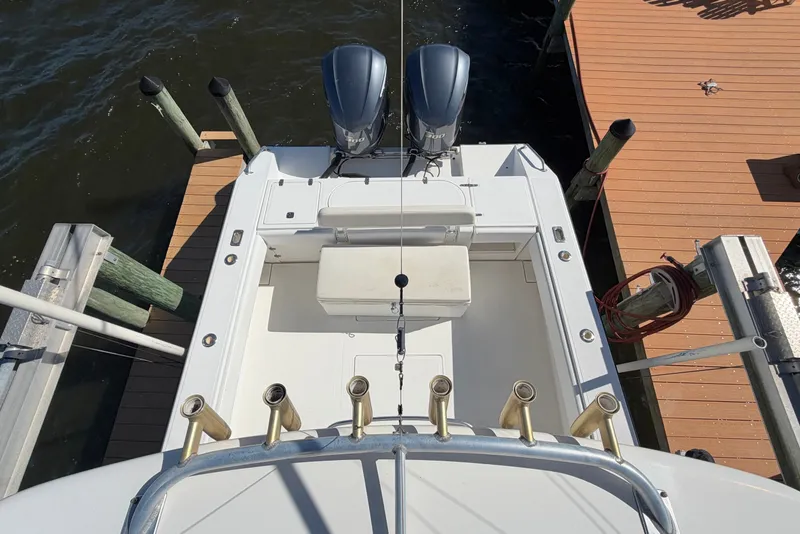 Slide: The Image of Overhead view of 2004 Venture 34 Cuddy boat docked with twin engines. - 96