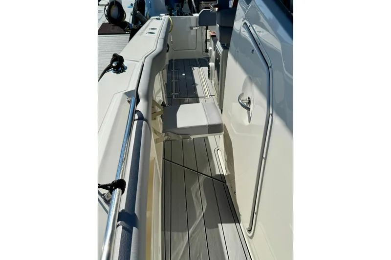 Slide: The Image of 2024 Boston Whaler 360 Outrage boat interior with sleek seating and modern design. - 39