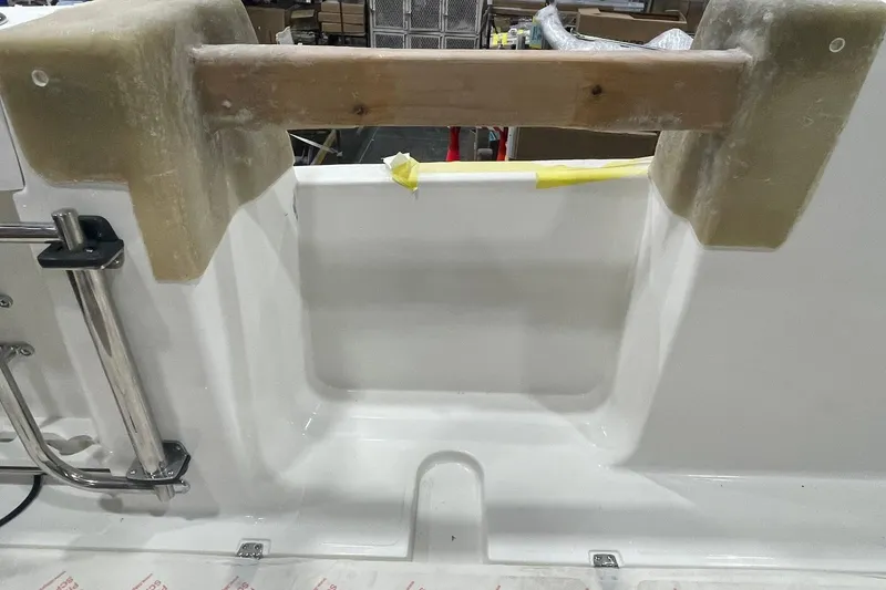 Slide: The Image of 2024 Boston Whaler 360 Outrage boat interior detail with ladder and unfinished components. - 64