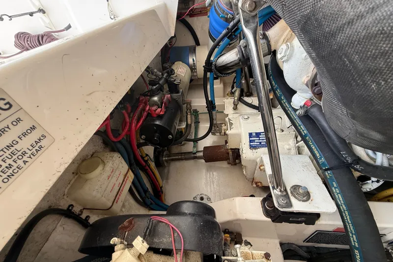Slide: The Image of Engine compartment of a 2007 Cabo 32 Express boat, showing mechanical components and wiring. - 41