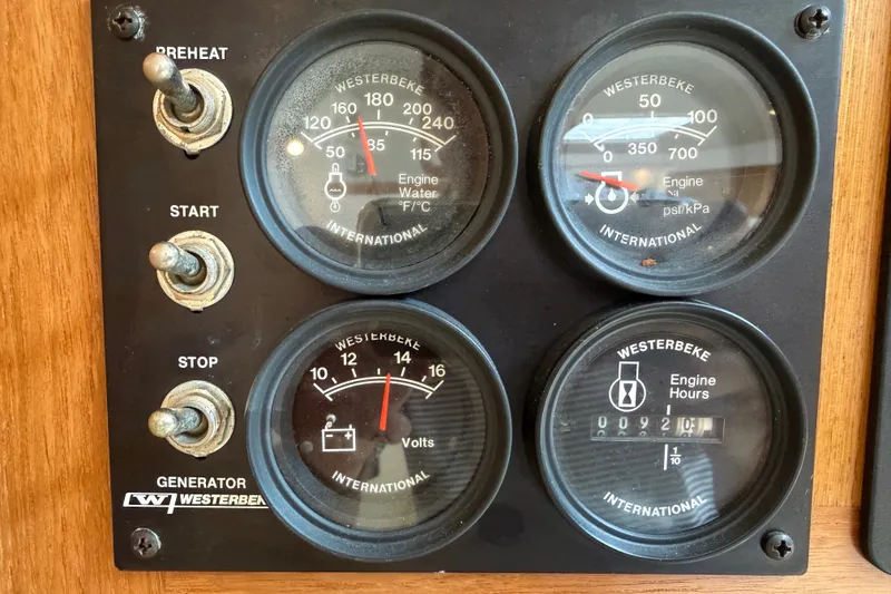 Slide: The Image of Control panel of a 2007 Cabo 32 Express boat with Westerbeke generator gauges. - 73