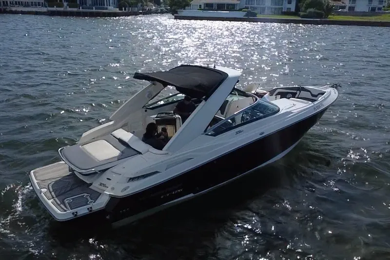 Slide: The Image of 2011 Monterey 328SS Super Sport boat cruising on a sunny lake. - 4