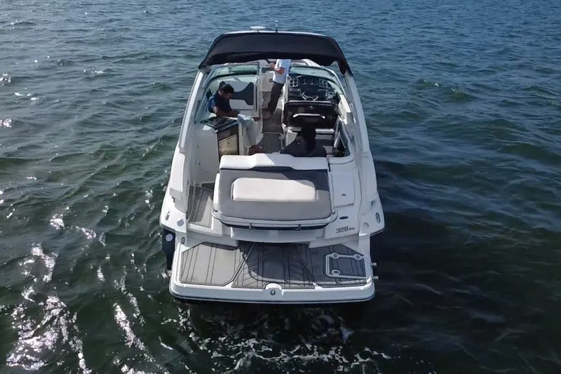 Slide: The Image of 2011 Monterey 328SS Super Sport boat cruising on open water. - 6