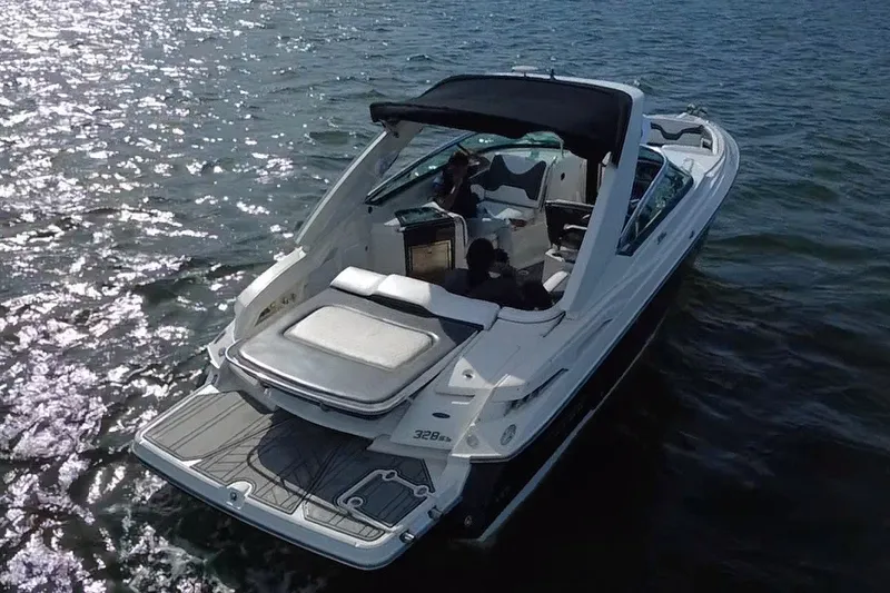 Slide: The Image of 2011 Monterey 328SS Super Sport boat cruising on sparkling water. - 5