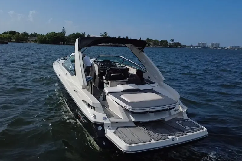 Slide: The Image of 2011 Monterey 328SS Super Sport boat cruising on a sunny day. - 7
