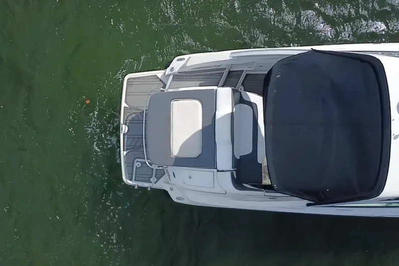 Slide: The Image of Overhead view of a 2011 Monterey 328SS Super Sport boat on green water. - 12