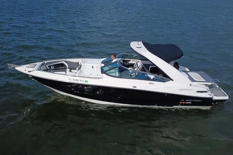 Slide: The Image of 2011 Monterey 328SS Super Sport boat cruising on open water. - 1