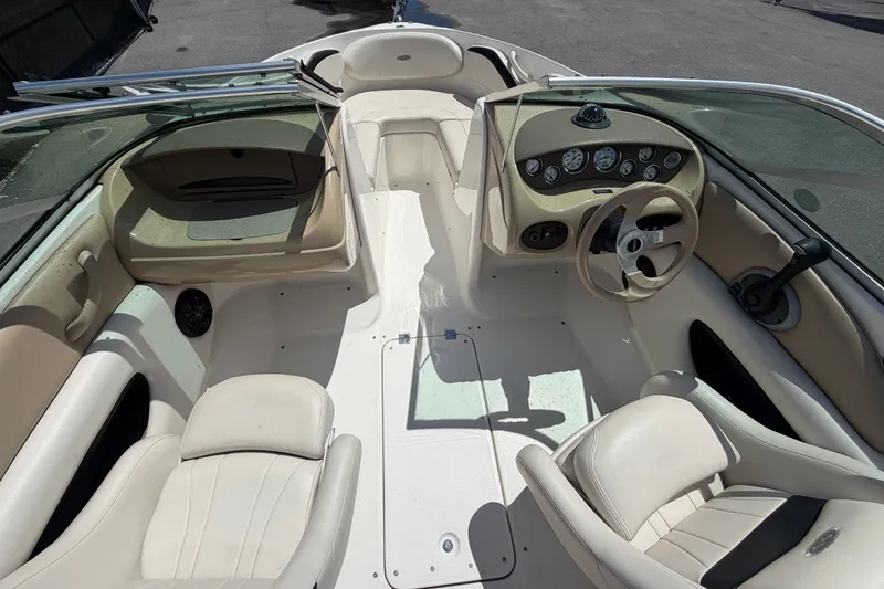 Slide: The Image of 2003 Chaparral 183 SS boat interior with steering wheel and seating. - 17