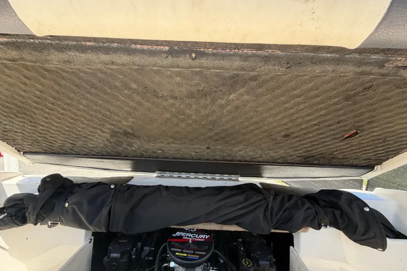 Slide: The Image of Open engine compartment of 2003 Chaparral 183 SS boat, showing Mercury engine. - 57