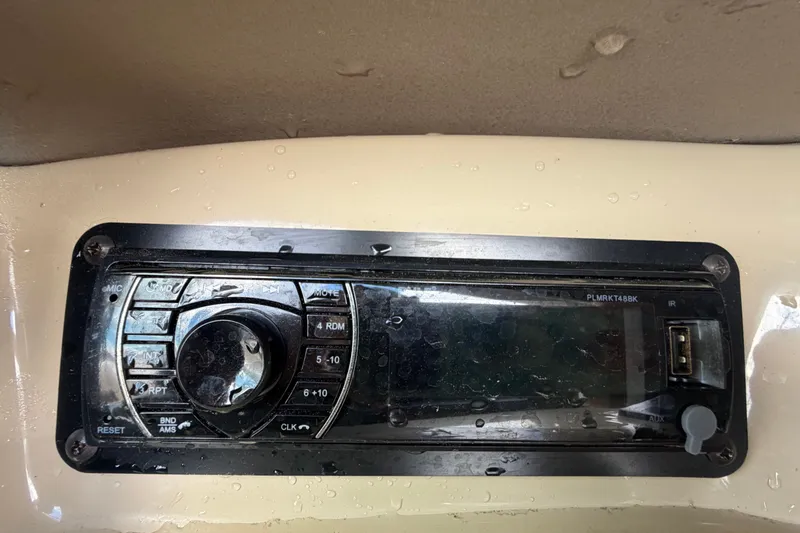 Slide: The Image of 2003 Chaparral 183 SS boat stereo system with control panel and USB port. - 32