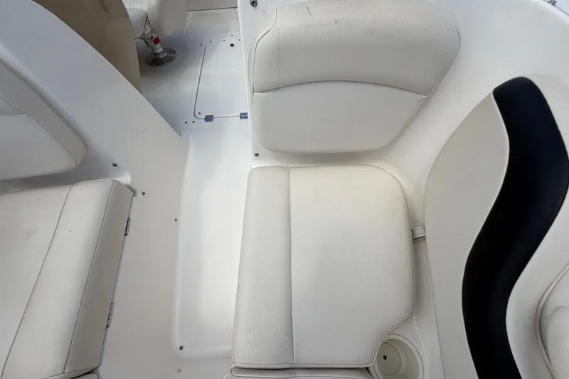 Slide: The Image of 2003 Chaparral 183 SS boat interior with white seating and clean deck. - 42