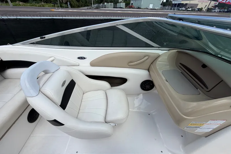 Slide: The Image of Interior of a 2003 Chaparral 183 SS boat with white seating and dashboard. - 28