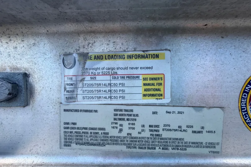 Slide: The Image of Tire and loading information label on a 2003 Chaparral 183 SS boat trailer. - 67