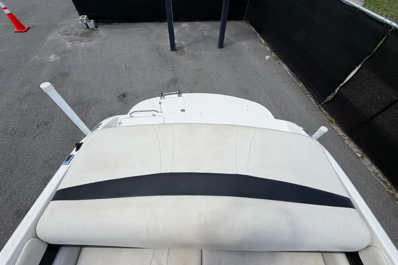 Slide: The Image of 2003 Chaparral 183 SS boat interior with white seating and black stripe. - 52