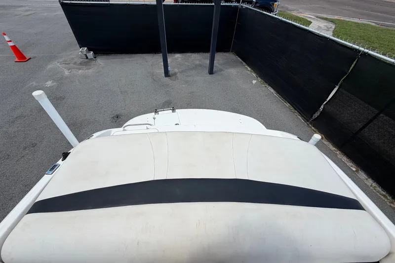 Slide: The Image of Rear view of a 2003 Chaparral 183 SS boat in a parking area. - 61